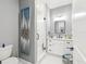Modern bathroom featuring a glass-enclosed shower, white vanity, and sleek fixtures at 1340 Bayshore Blvd # 502, Dunedin, FL 34698