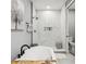 Spa-like bathroom with a standalone tub, glass shower, and elegant tile work at 1340 Bayshore Blvd # 502, Dunedin, FL 34698