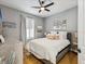 Relaxing bedroom with a plush bed, modern decor, window with shutters, and ample natural light at 1340 Bayshore Blvd # 502, Dunedin, FL 34698