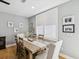 Light and airy dining room with modern lighting, plantation shutters, and seating for six at 1340 Bayshore Blvd # 502, Dunedin, FL 34698
