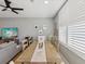 Dining room with a ceiling fan, a large table, and a view to the living room at 1340 Bayshore Blvd # 502, Dunedin, FL 34698