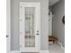 Entryway with a glass door, bench seating, decorative shelving, and tiled floors at 1340 Bayshore Blvd # 502, Dunedin, FL 34698