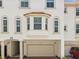 Stunning three-story condo featuring arched windows, and a private two-car garage at 1340 Bayshore Blvd # 502, Dunedin, FL 34698