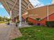 Exterior view of the Dunedin Fine Art Center with inviting outdoor seating and vibrant landscaping at 1340 Bayshore Blvd # 502, Dunedin, FL 34698