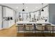 Spacious white kitchen features a large island with bar seating, modern appliances, and wood flooring at 1340 Bayshore Blvd # 502, Dunedin, FL 34698