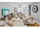 Open living room with hardwood floors, comfortable seating, and a modern ceiling fan at 1340 Bayshore Blvd # 502, Dunedin, FL 34698