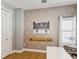 Stylish home office featuring a white desk, hardwood floors, ballet decor, and contemporary wallpaper at 1340 Bayshore Blvd # 502, Dunedin, FL 34698