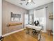 Stylish home office featuring a white desk, hardwood floors, ballet decor, and contemporary wallpaper at 1340 Bayshore Blvd # 502, Dunedin, FL 34698
