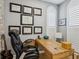 Inviting home office featuring a natural wood desk, leather chair, and stylishly framed diplomas at 1340 Bayshore Blvd # 502, Dunedin, FL 34698