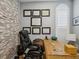 Inviting home office featuring a natural wood desk, leather chair, and stylishly framed diplomas at 1340 Bayshore Blvd # 502, Dunedin, FL 34698
