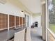 Large outdoor patio with dining table, seating, a barbecue grill, and a view of the yard at 1340 Bayshore Blvd # 502, Dunedin, FL 34698