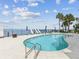 Breathtaking community pool area with lounge chairs and beautiful views of the bay at 1340 Bayshore Blvd # 502, Dunedin, FL 34698