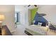 Comfortable bedroom featuring unique design and ample natural light, offering a cozy retreat at 135 Mangrove Shade Cir, Apollo Beach, FL 33572