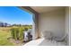 Covered lanai features chairs overlooking the private backyard and water views at 135 Mangrove Shade Cir, Apollo Beach, FL 33572
