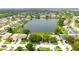 Panoramic aerial view of homes surrounding a picturesque lake in a tranquil neighborhood at 1423 Birchstone Ave, Brandon, FL 33511