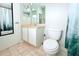 Bathroom featuring a toilet, sink vanity, and shower with nature curtain at 1423 Birchstone Ave, Brandon, FL 33511