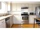 Kitchen features stainless appliances, granite countertops and bright cabinets at 1423 Birchstone Ave, Brandon, FL 33511