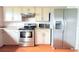 Kitchen with stainless appliances, granite countertops, and bright cabinets at 1423 Birchstone Ave, Brandon, FL 33511