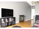 Living room has wood laminate flooring, neutral grey paint, and a furniture arrangement conducive to entertaining at 1423 Birchstone Ave, Brandon, FL 33511