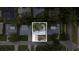 Aerial view of charming property with mature trees at 1506 Winding W Way, Clearwater, FL 33764