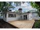 Charming backyard deck off white home at 1506 Winding W Way, Clearwater, FL 33764