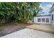 Backyard featuring new deck and gravel at 1506 Winding W Way, Clearwater, FL 33764