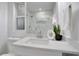 A modern bathroom with granite counters, black accents, a glass shower, and tasteful decor at 1506 Winding W Way, Clearwater, FL 33764