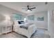 Cozy bedroom with serene blue accents, natural light, and comfortable furniture at 1506 Winding W Way, Clearwater, FL 33764