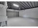 Spacious garage with high ceilings, equipped with garage door at 1506 Winding W Way, Clearwater, FL 33764