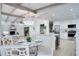 Bright, modern kitchen featuring stainless appliances and open layout to the dining and living spaces at 1506 Winding W Way, Clearwater, FL 33764