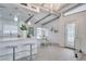 Bright kitchen with an open layout and stainless steel appliances flows into the dining area at 1506 Winding W Way, Clearwater, FL 33764