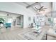 Open-concept living room featuring stylish decor, vaulted ceilings, and lots of natural light with an open floor plan at 1506 Winding W Way, Clearwater, FL 33764