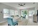 Inviting living room featuring stylish decor, sliding doors to the backyard, and lots of natural light at 1506 Winding W Way, Clearwater, FL 33764