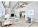 Bright living room features vaulted ceilings, a cozy fireplace, and stylish furnishings with an open floor plan at 1506 Winding W Way, Clearwater, FL 33764