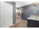 Clean bathroom with shower and tub combo and gray walls at 15406 Gopher Trop Pl, Sun City Center, FL 33573