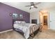 This spacious bedroom has a window and doorway leading into the bathroom at 15406 Gopher Trop Pl, Sun City Center, FL 33573