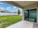 Covered patio overlooking a large, well-maintained fenced backyard at 15406 Gopher Trop Pl, Sun City Center, FL 33573