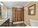 Bathroom features include tile flooring, granite countertops, and tiled tub at 16205 Sentry Woods Ct, Odessa, FL 33556