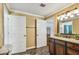Bright bathroom with granite countertops and easy access to multiple rooms at 16205 Sentry Woods Ct, Odessa, FL 33556