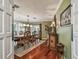Formal dining room boasts decorative wood furniture, overhead lighting, and neutral wall paint at 16205 Sentry Woods Ct, Odessa, FL 33556