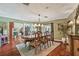 Formal dining room boasts decorative wood furniture, overhead lighting, and neutral wall paint at 16205 Sentry Woods Ct, Odessa, FL 33556