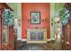 Inviting foyer featuring a colorful accent wall, decorative furniture, and slate tile flooring at 16205 Sentry Woods Ct, Odessa, FL 33556