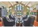Bright living room with high ceiling, stylish furniture, and water views at 16205 Sentry Woods Ct, Odessa, FL 33556