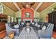 Open living room with a fireplace, high ceiling, and dark hardwood flooring at 16205 Sentry Woods Ct, Odessa, FL 33556