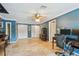 Inviting living room with tiled floors, neutral decor, and ample natural light at 16205 Sentry Woods Ct, Odessa, FL 33556