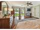 Spacious main bedroom with walk-out to patio, beautiful rug, and ceiling fan at 16205 Sentry Woods Ct, Odessa, FL 33556