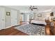 Spacious main bedroom with walk-out to patio, beautiful rug, and ceiling fan at 16205 Sentry Woods Ct, Odessa, FL 33556