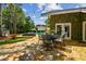 Spacious stone patio with outdoor dining, lakeside views, and pool at 16205 Sentry Woods Ct, Odessa, FL 33556