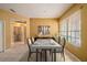 Dining room with a neutral color scheme, natural lighting, and access to nearby rooms at 1914 Sassafras Dr, Wesley Chapel, FL 33543