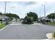 Gated entrance to a community with well-maintained landscaping and secure access control at 1914 Sassafras Dr, Wesley Chapel, FL 33543